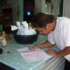 Tanroo signing his visa form !