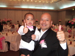 Coach Acfalle and Grandson gives thumb up at the reception