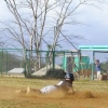 Fiji center fielder Semi Bolatini slides in safe at home