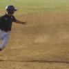 Joeli McGoon rounding third.