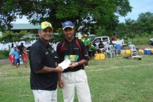 Brian Bell's all rounder Joel Tom recieving his man of the match award from PNGCB treasurer Kuhaseelan Rajadurai after taking two vital wickets and scoring 29 runs in their round 2 win agaisnt Trukai Invincibles.