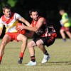 Sawtell/Toormina midfielder Luke Benson tries to escape the close attention of his Coffs Swans opponent at Fitzroy Oval. Photo: Leigh Jensen / Coffs Coast Advocate