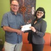 Brad Tallon, Chairman SEQ Division presenting cheque to Micah Projects