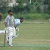Trukai Invincible captain John Ovia ready to run as Telikom Titans bowler Jimmy Maha delivers a ball