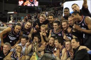 Nathan Herbert celebrates the NBL title with his Dragons teammates.