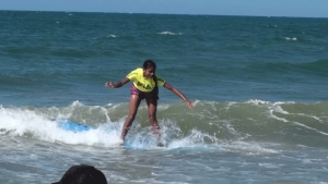 Kira surfing at girls get out there