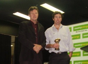 Paul Brown receives the 2010 Sporting Pulse Award from Adrian Walsh