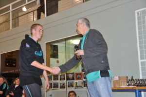 Lachie Caple receives his MVP award from President Carl Wilkinson